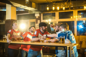 Soccer supporters fighting in a bar