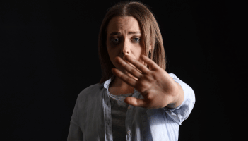 A woman fighting against a man