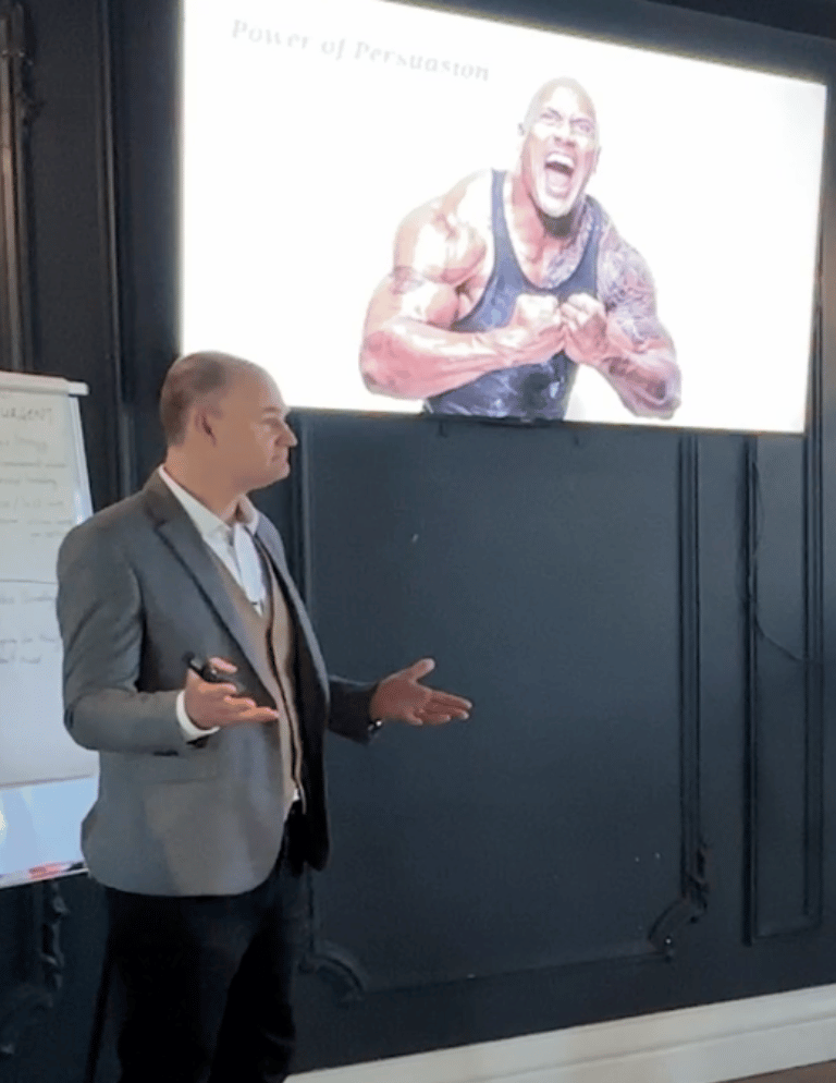 Medium_Image_768x994_ethical_Persuasion_Patrick_van_der_Burght_presening_12_TheRock_slide Patrick van der Burght, Cialdini Licensed Trainer, delivering a keynote presentation, touching on contrast