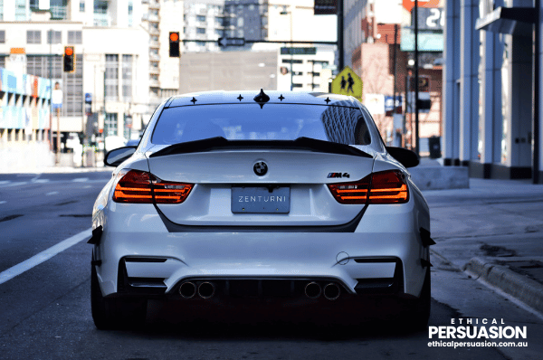 A luxury car not pulling away when the light turned green, and 50% of people never honked the horn
